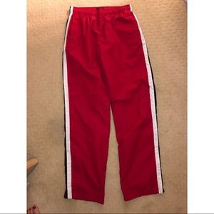 Red windbreaker pants